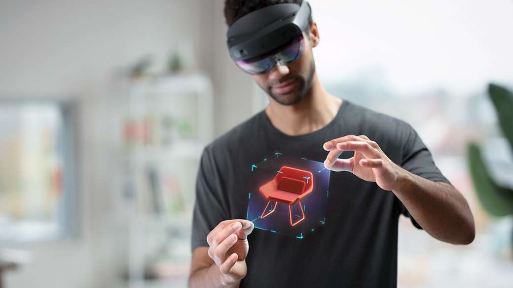 A guy in black shirt wearing the Microsoft HoloLens